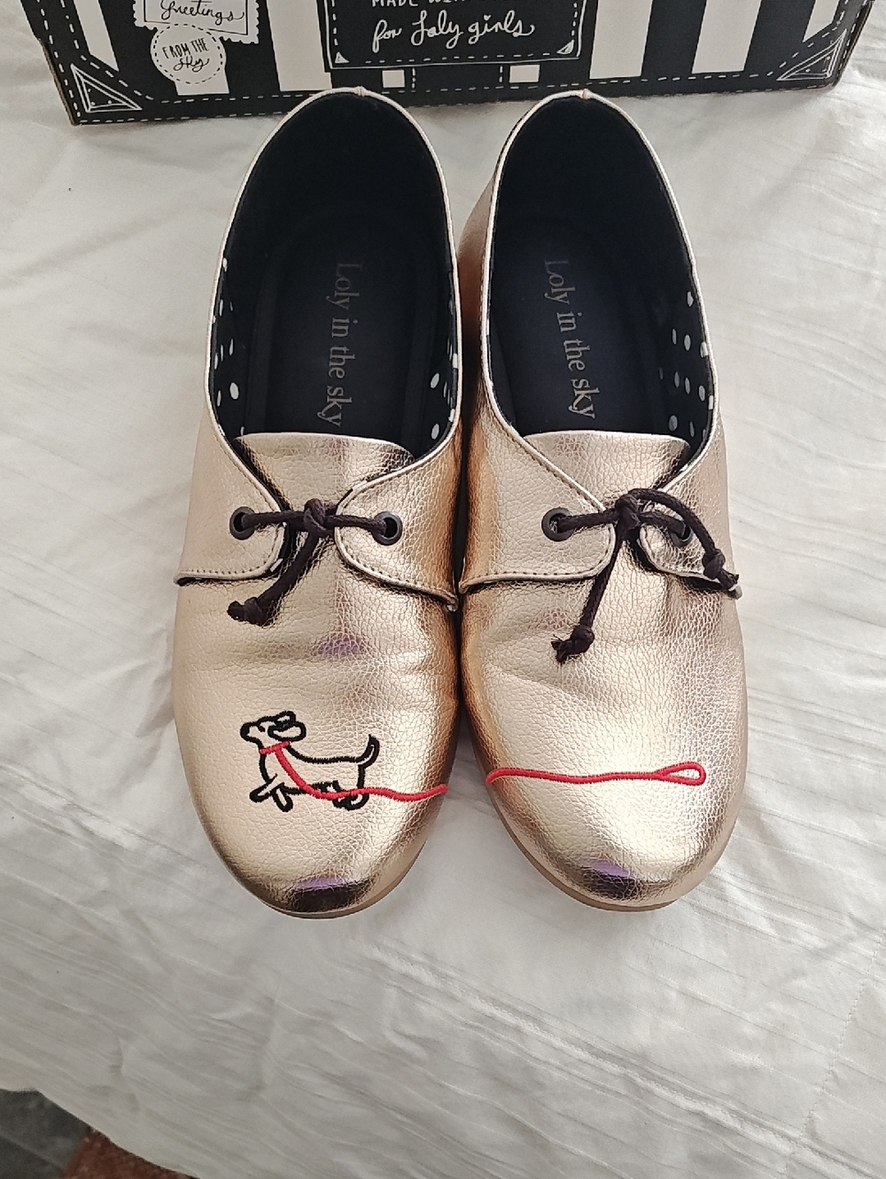 Loly in the Sky Metallic Copper Derby Flats with Embroidered Dog And Red Leash.